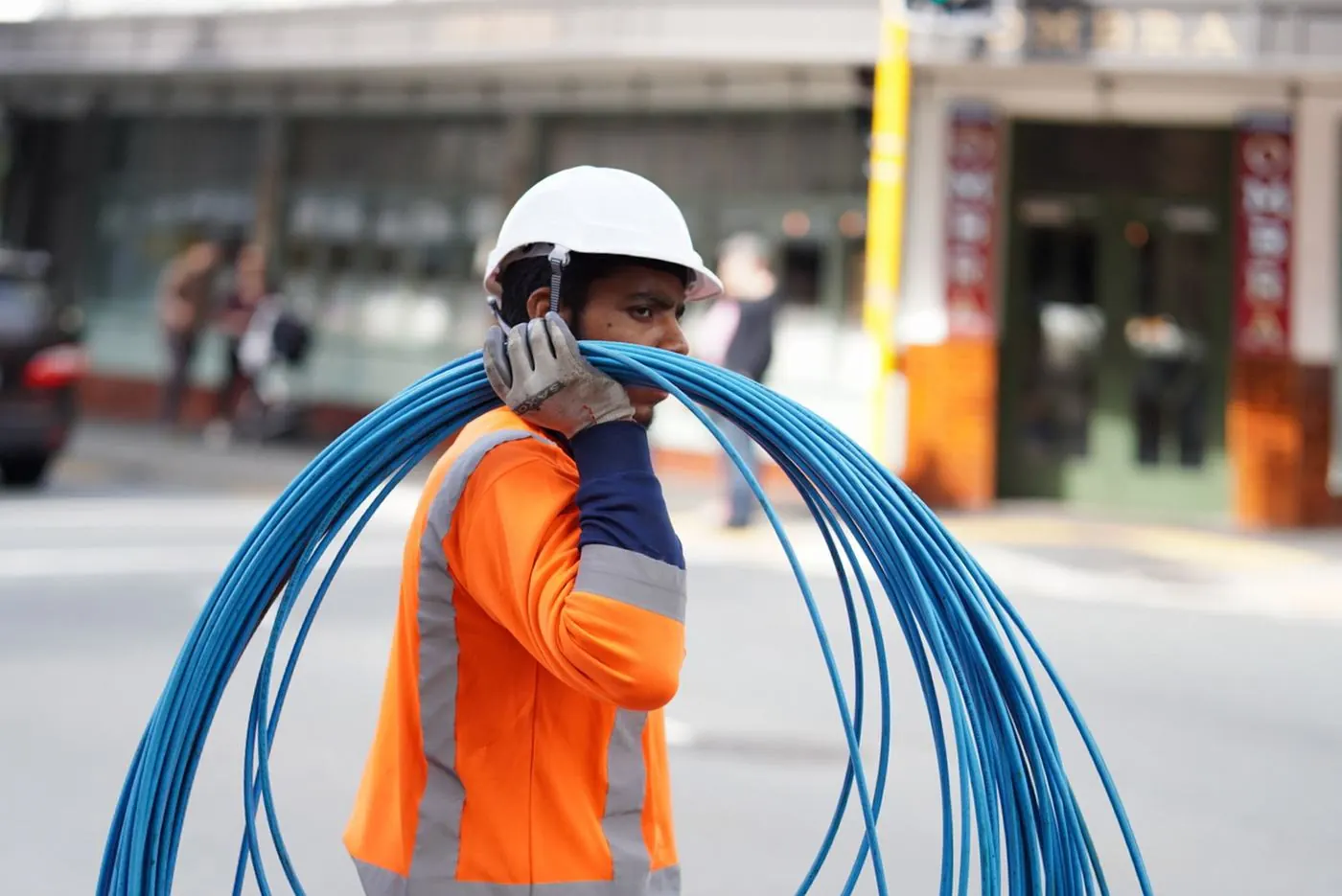 Crew member carrying coiled duct