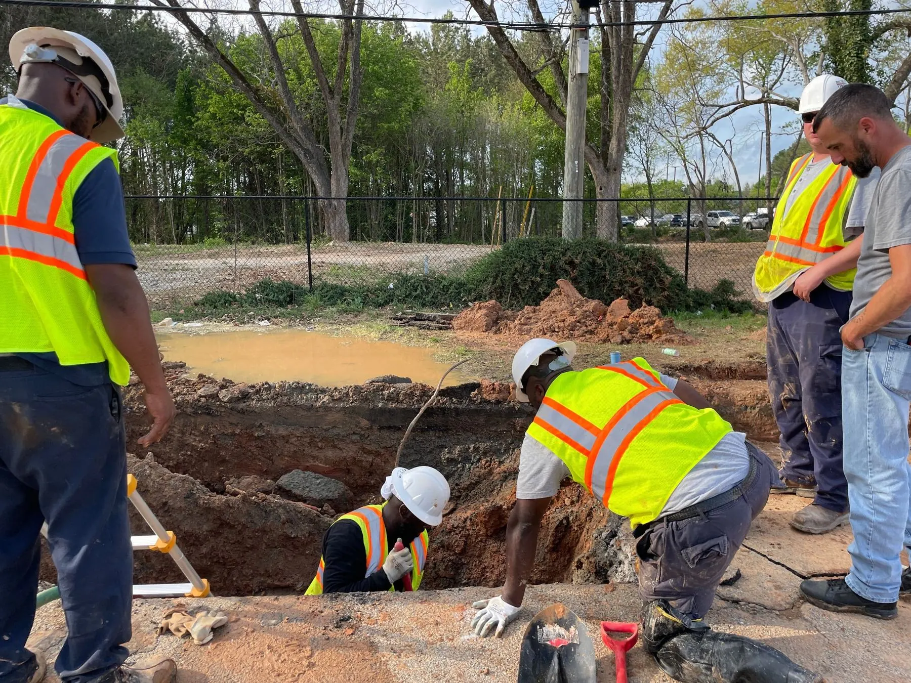 Crew working around an open trench